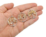 Citrine Tree of Life gemstone pendant with intricate wirework, showcasing vibrant orange-yellow citrine crystals on a silver-tone setting.