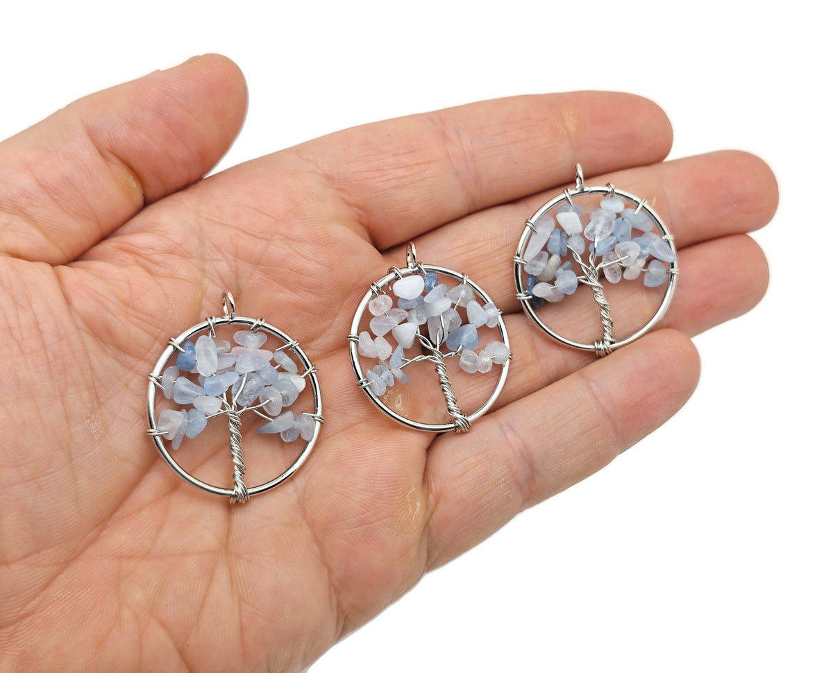 Aquamarine Tree of Life gemstone pendant from GemstoneGO featuring a detailed crystal and metal tree design.