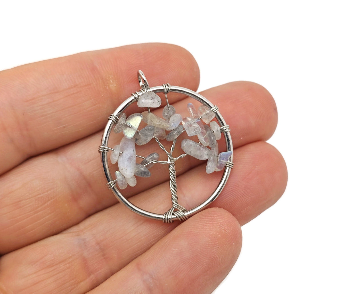 Moonstone Tree of Life gemstone pendant by GemstoneGO featuring a detailed tree design on a polished moonstone gemstone.