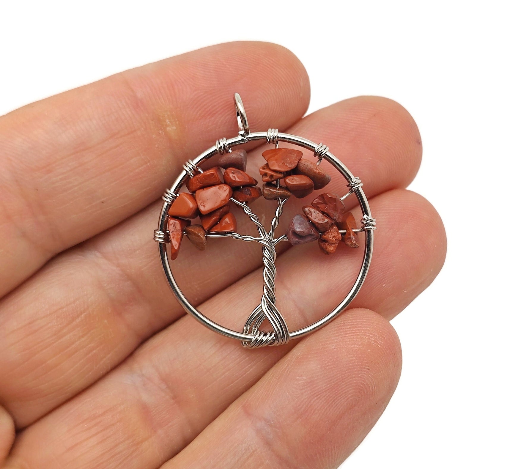 Red Jasper Tree of Life gemstone pendant from GemstoneGO, featuring a detailed tree design on a red jasper stone.