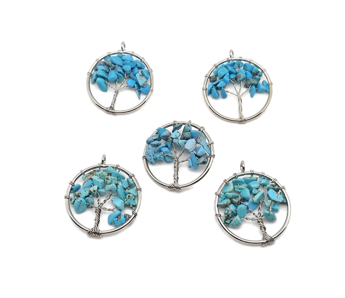 Turquoise Tree of Life gemstone pendant by GemstoneGO featuring a detailed crystal design on silver-tone setting.