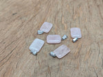 Rose quartz rectangle-shaped crystal pendant from GemstoneGO, showcasing a polished pink gemstone pendant on a silver chain.