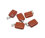 Red Jasper rectangle-shaped crystal pendant from GemstoneGO, showcasing vibrant red gemstone with polished surface.