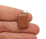 Goldstone rectangle-shaped crystal pendant from GemstoneGO featuring a shimmering goldstone gemstone on a silver chain.