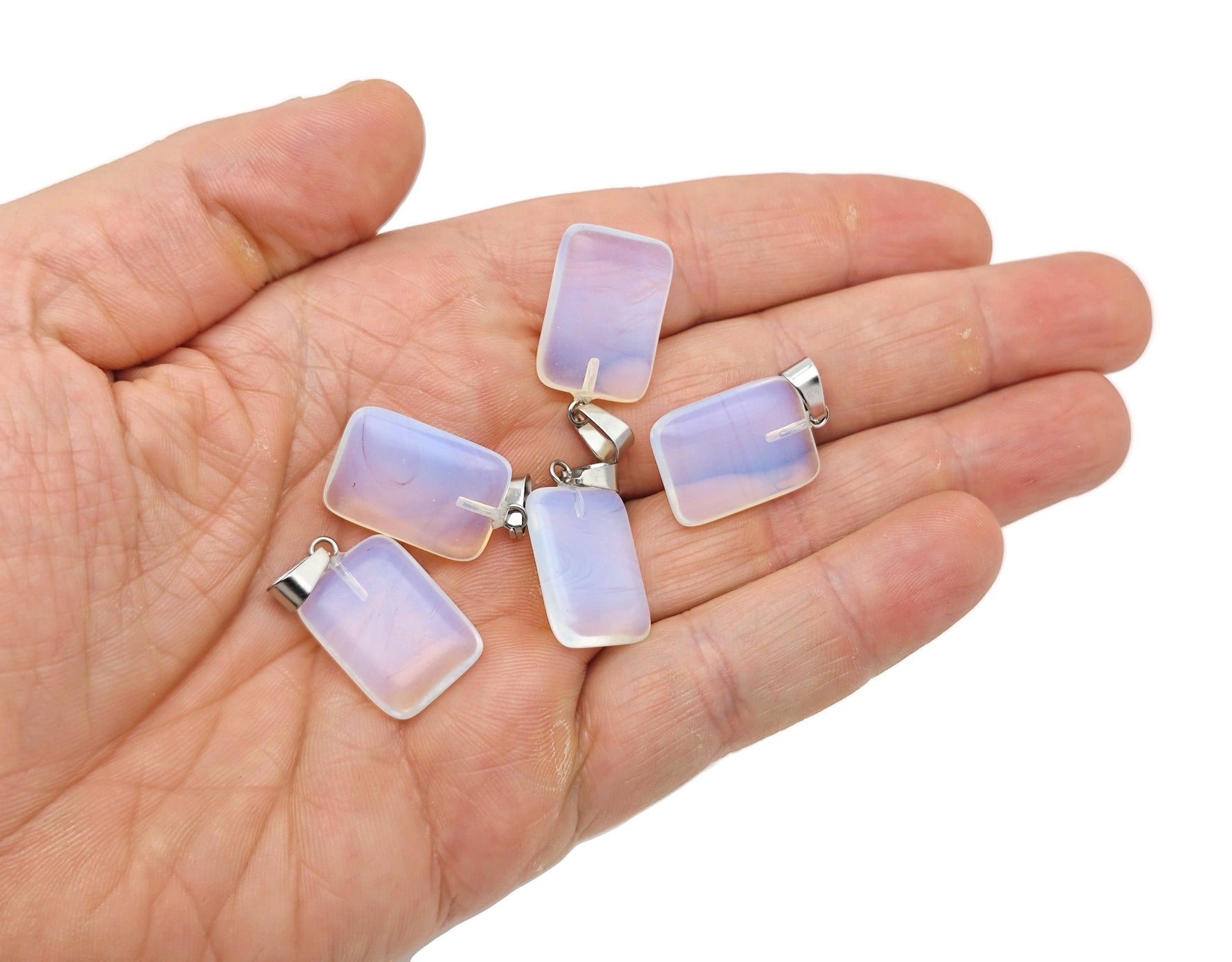 Opalite rectangular crystal pendant from GemstoneGO, showcasing a smooth, polished gemstone on a silver setting.