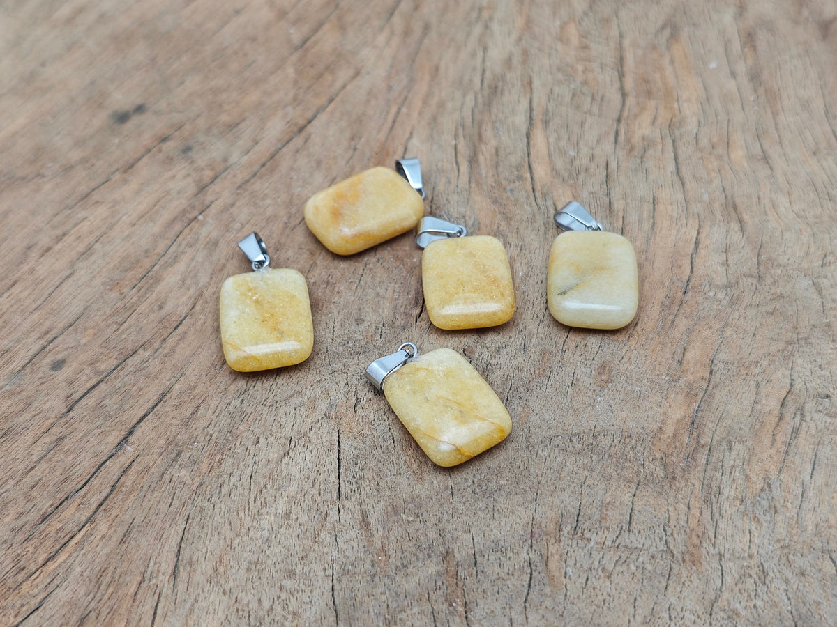 Yellow jade rectangle-shaped crystal pendant from GemstoneGO, showcasing a vibrant yellow gemstone with a polished rectangular cut.