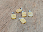 Yellow jade rectangle-shaped crystal pendant from GemstoneGO, showcasing a vibrant yellow gemstone with a polished rectangular cut.