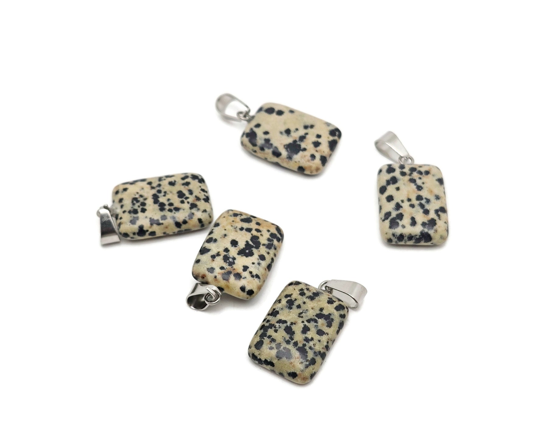 Dalmatian Jasper rectangle crystal pendant from GemstoneGO, showcasing black and cream spotted gemstone with polished finish.