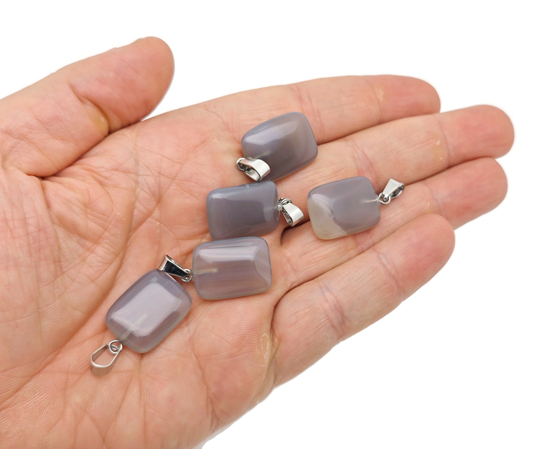 Grey agate rectangle-shaped crystal pendant from GemstoneGO, showcasing a polished, natural gemstone with silver casing.