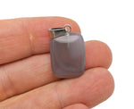 Grey agate rectangle-shaped crystal pendant from GemstoneGO, showcasing a smooth, polished gemstone with natural banding and a silver setting.