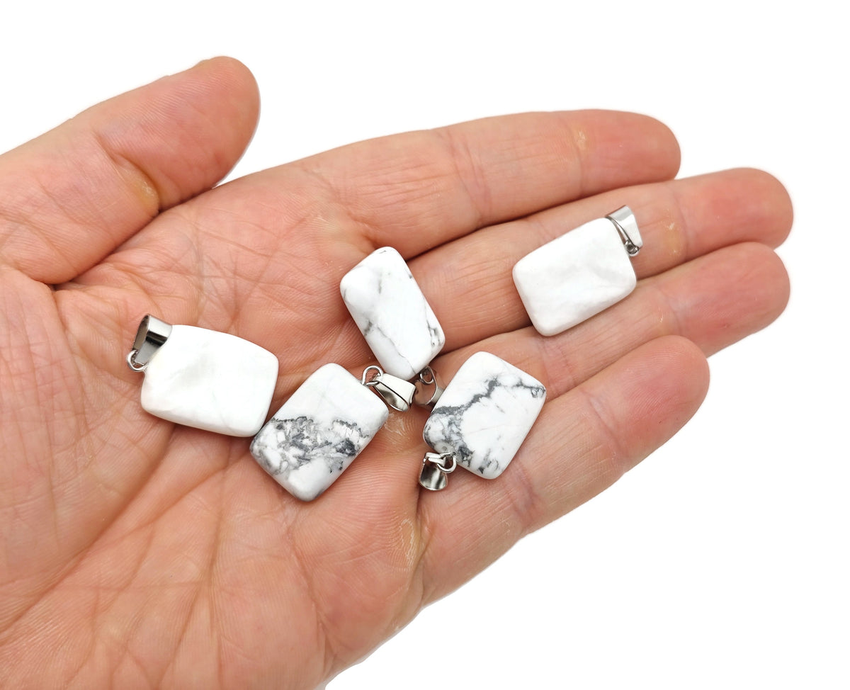 Howlite rectangle-shaped crystal pendant by GemstoneGO, showcasing smooth white gemstone with gray veining on a jewelry chain.
