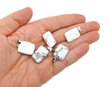 Howlite rectangle-shaped crystal pendant by GemstoneGO, showcasing smooth white gemstone with gray veining on a jewelry chain.
