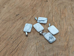 Howlite rectangle shape crystal pendant from GemstoneGO, showcasing a polished white gemstone with gray veining on a silver chain.