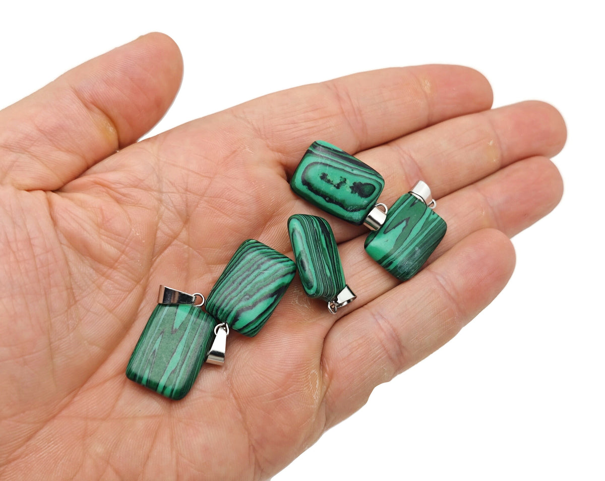 Rectangular synthetic malachite crystal pendant with vibrant green and black banding, featuring a polished gemstone pendant for jewelry.