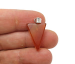 Carnelian triangle-shaped crystal pendant from GemstoneGO, showcasing its vibrant orange gemstone with polished surface.