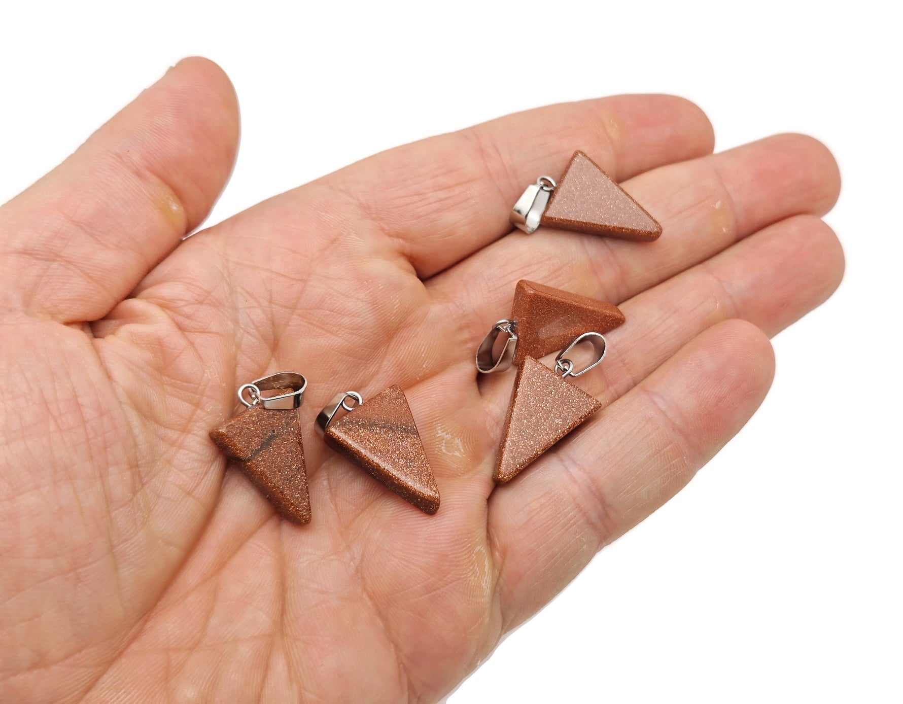 Goldstone triangle-shaped crystal pendant from GemstoneGO, showcasing a sparkling goldstone gemstone with a polished triangle design.