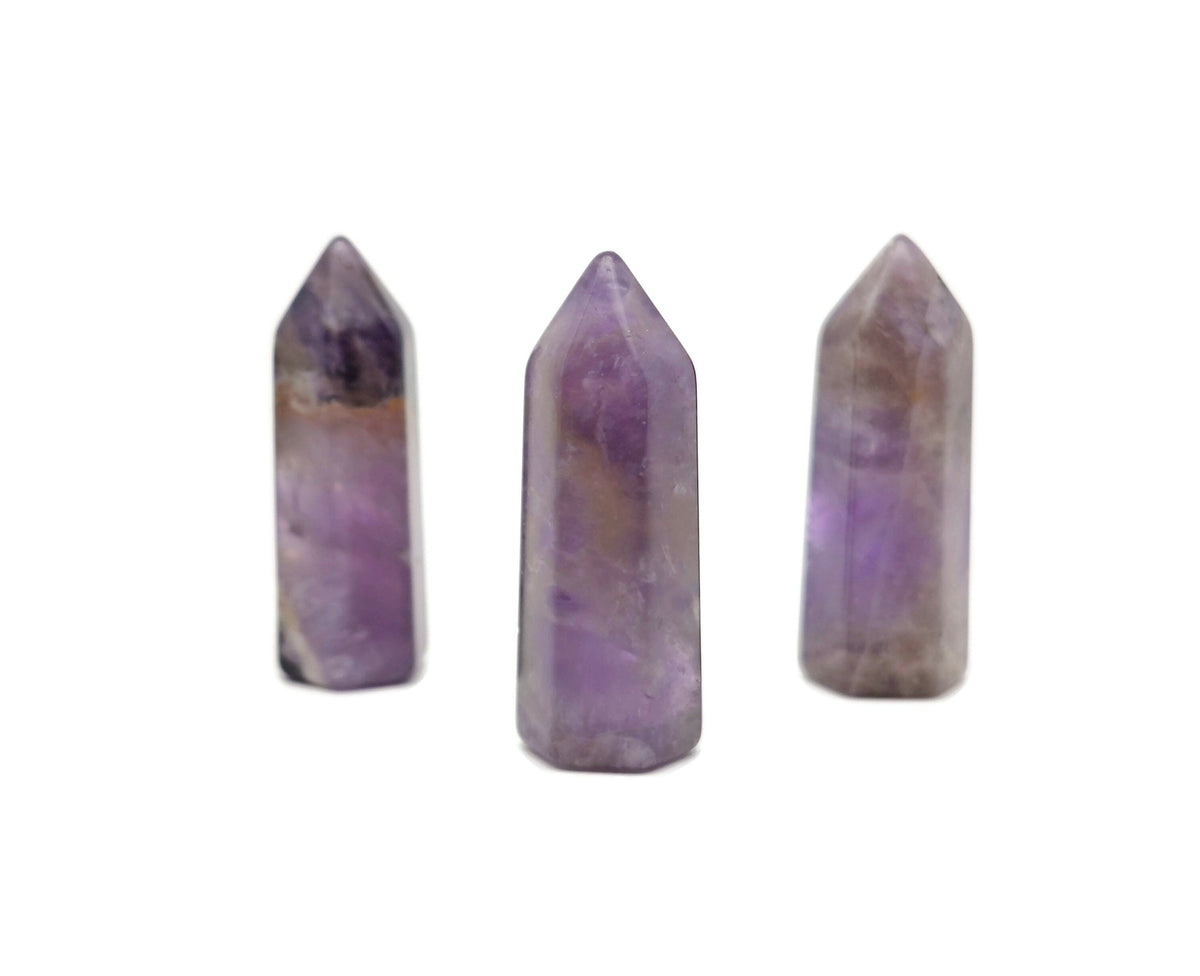Amethyst obelisk tower crystal 40mm from GemstoneGO showing purple gemstone with natural crystal formations.