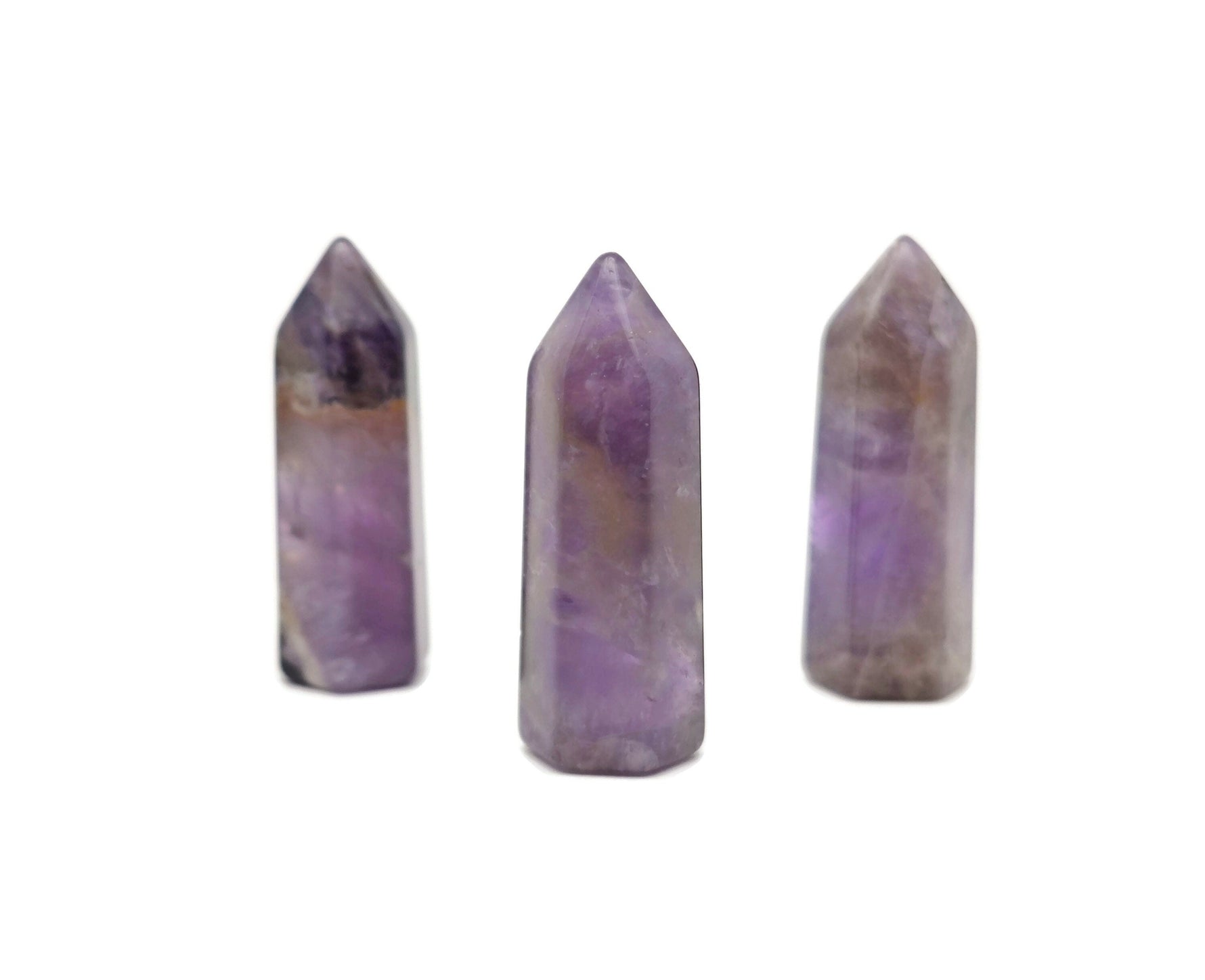 Amethyst obelisk tower crystal 40mm from GemstoneGO showing purple gemstone with natural crystal formations.