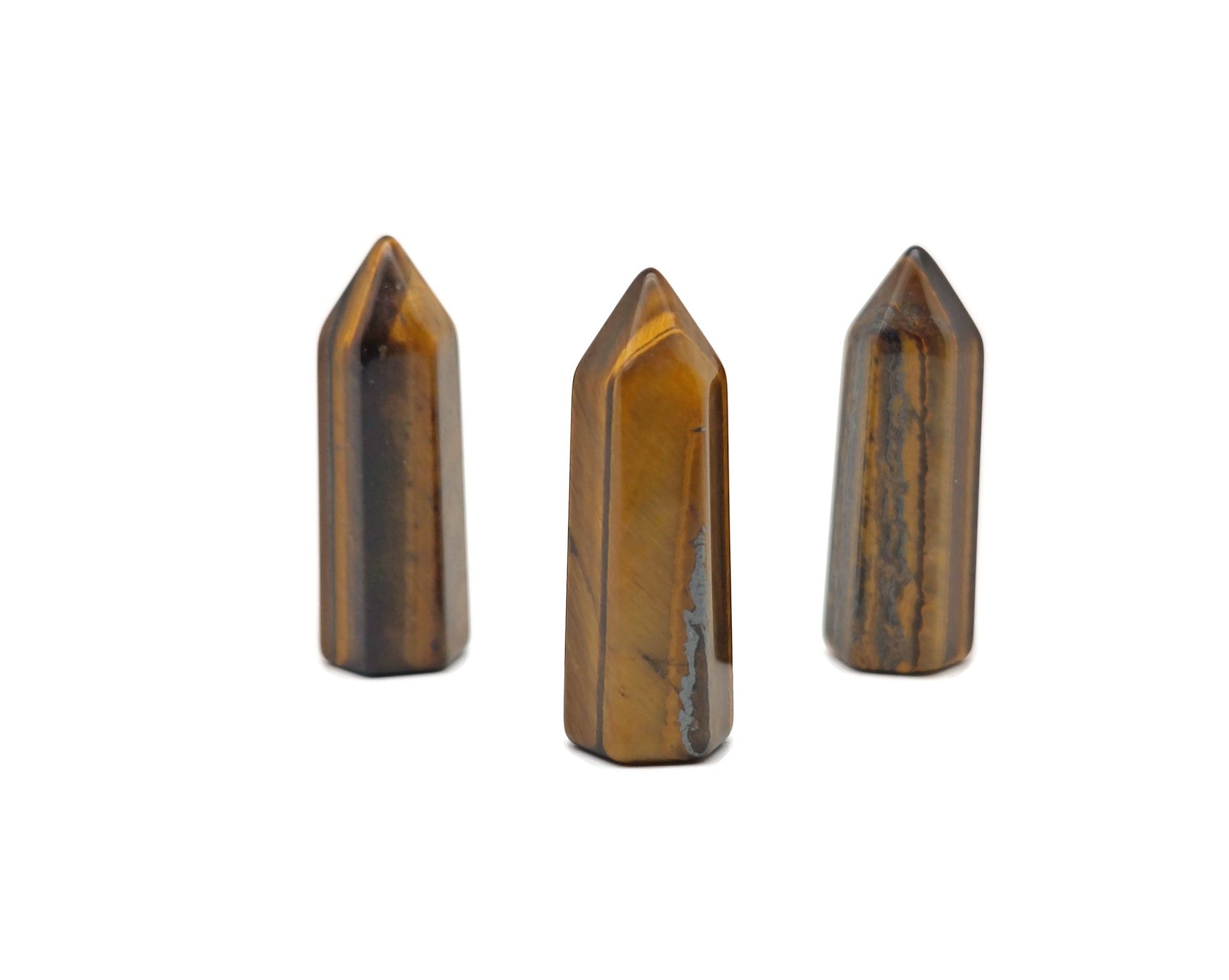 Tiger Eye obelisk tower crystal, 40mm gemstone from GemstoneGO, showing its polished golden-brown banded appearance and smooth surfaces.