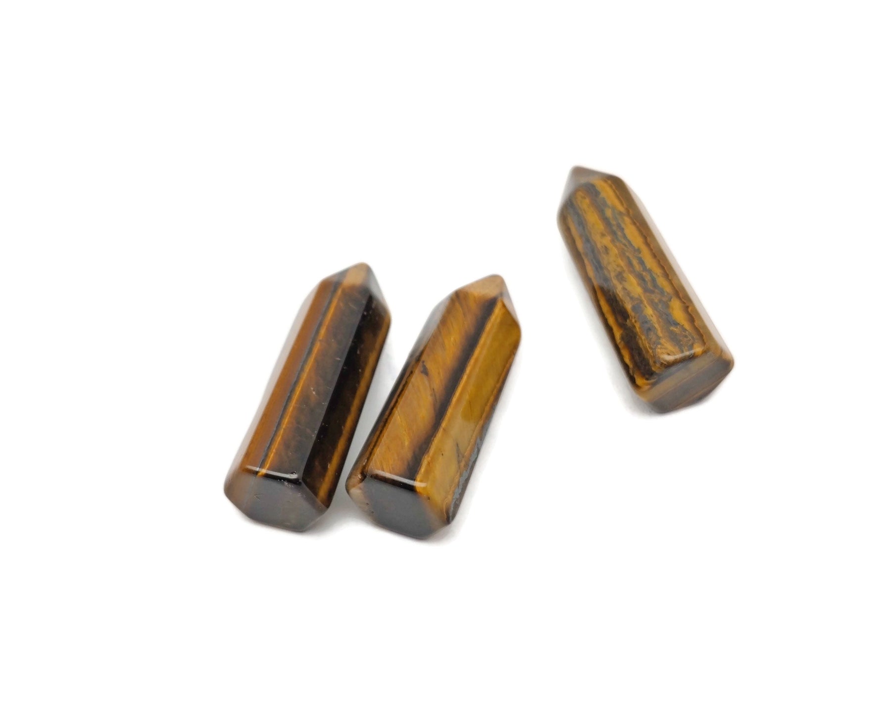 Tiger Eye obelisk tower crystal, 40mm by GemstoneGO, featuring smooth polished surface and distinctive golden-brown stripes.