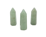 Aventurine obelisk tower crystal from GemstoneGO, 40mm tall, with green and sparkling gemstone features on a neutral background.