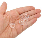 Clear quartz crystal donut pendant from GemstoneGO, 18mm Pi Stone with a smooth, polished surface and circular shape.