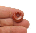 Red Jasper crystal donut pendant from GemstoneGO, 18mm Pi Stone with vibrant red color and polished smooth surface.