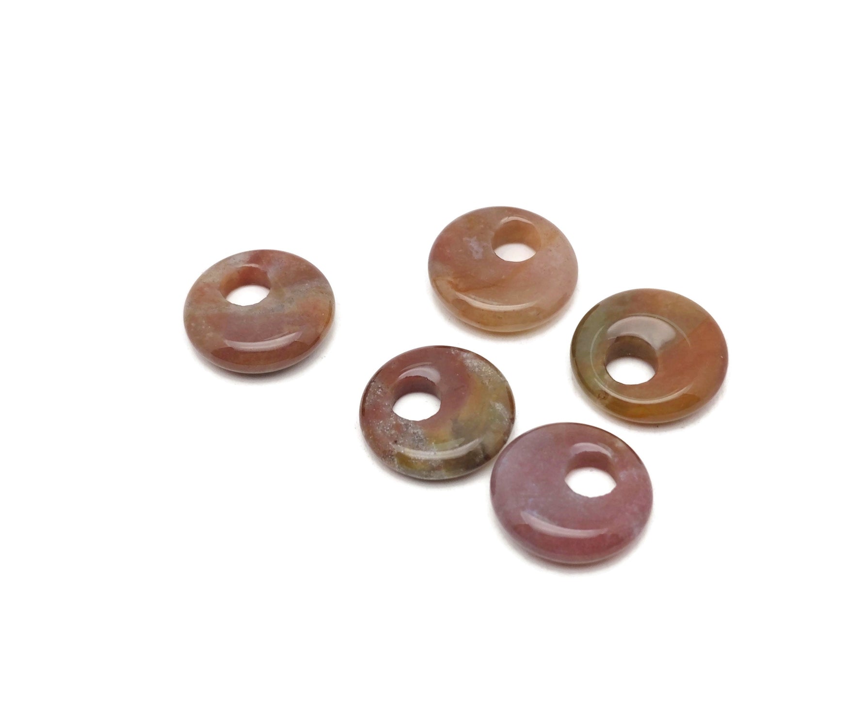 Moss agate crystal donut pendant with natural green and brown patterns, 18mm gemstone from GemstoneGO on a white background.