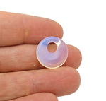 Opalite crystal donut pendant from GemstoneGO, 18mm Pi stone with smooth, polished surface and vibrant, glowing appearance.