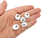 Howlite crystal donut pendant, 18mm Pi stone by GemstoneGO, featuring a smooth, polished white stone with subtle gray veining.
