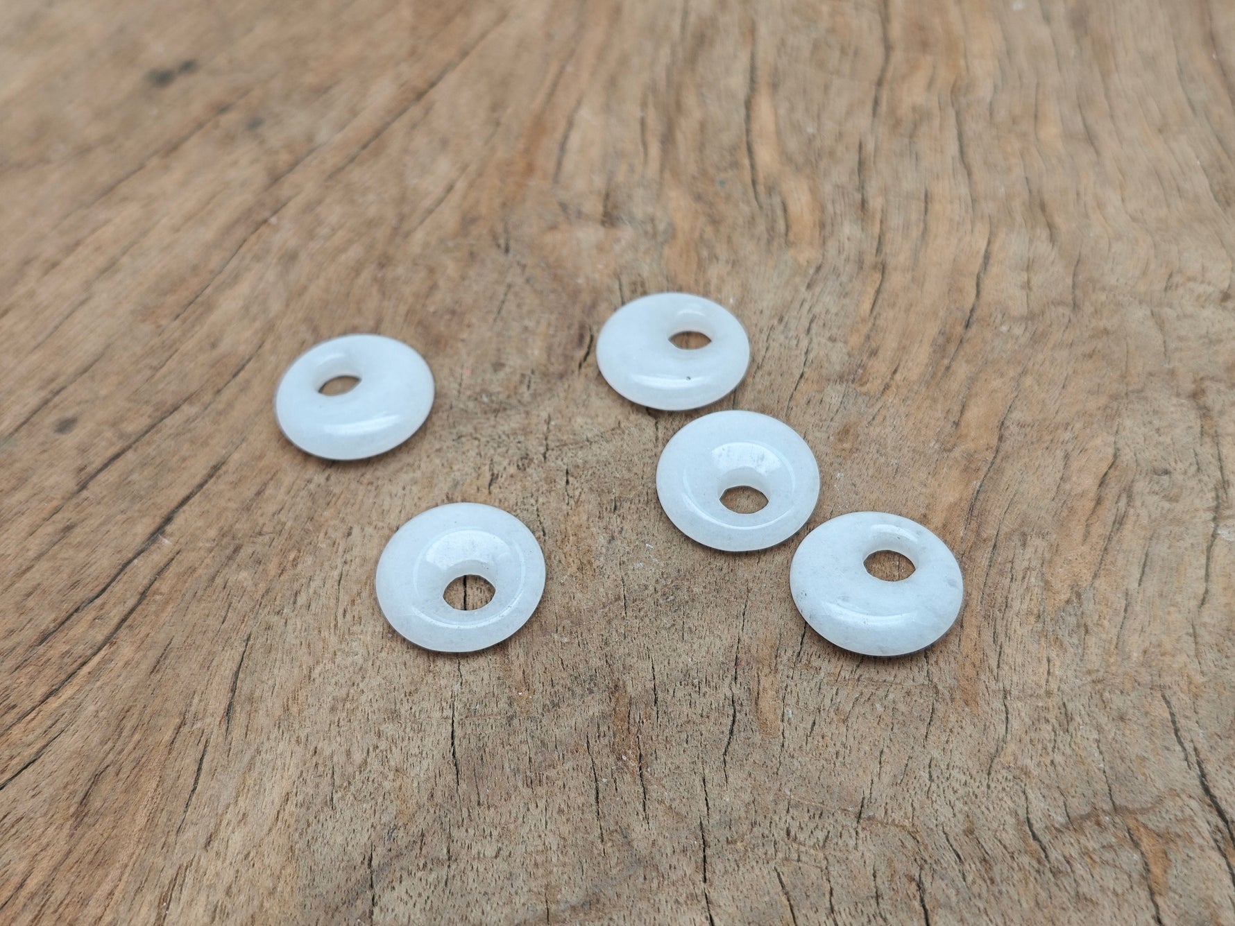 White Jade crystal donut pendant with 18mm Pi stone from GemstoneGO, showcasing smooth round shape and polished surface.