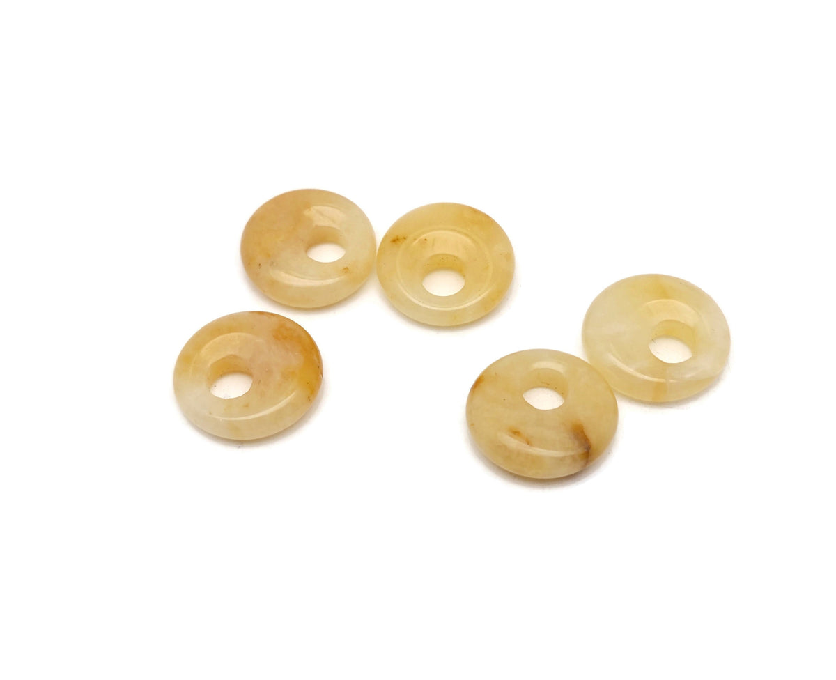 Yellow jade crystal donut pendant with 18mm Pi stone, showcasing smooth, polished surface and vibrant yellow color from GemstoneGO.