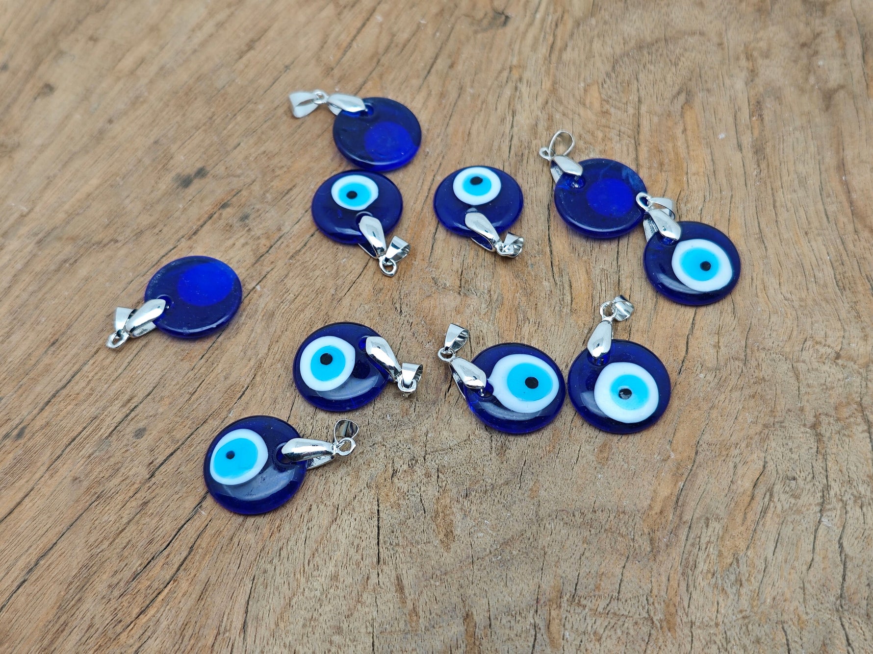 Glass evil eye pendant from GemstoneGO featuring vibrant blue and white colors, perfect for gift jewelry or protective accessories.