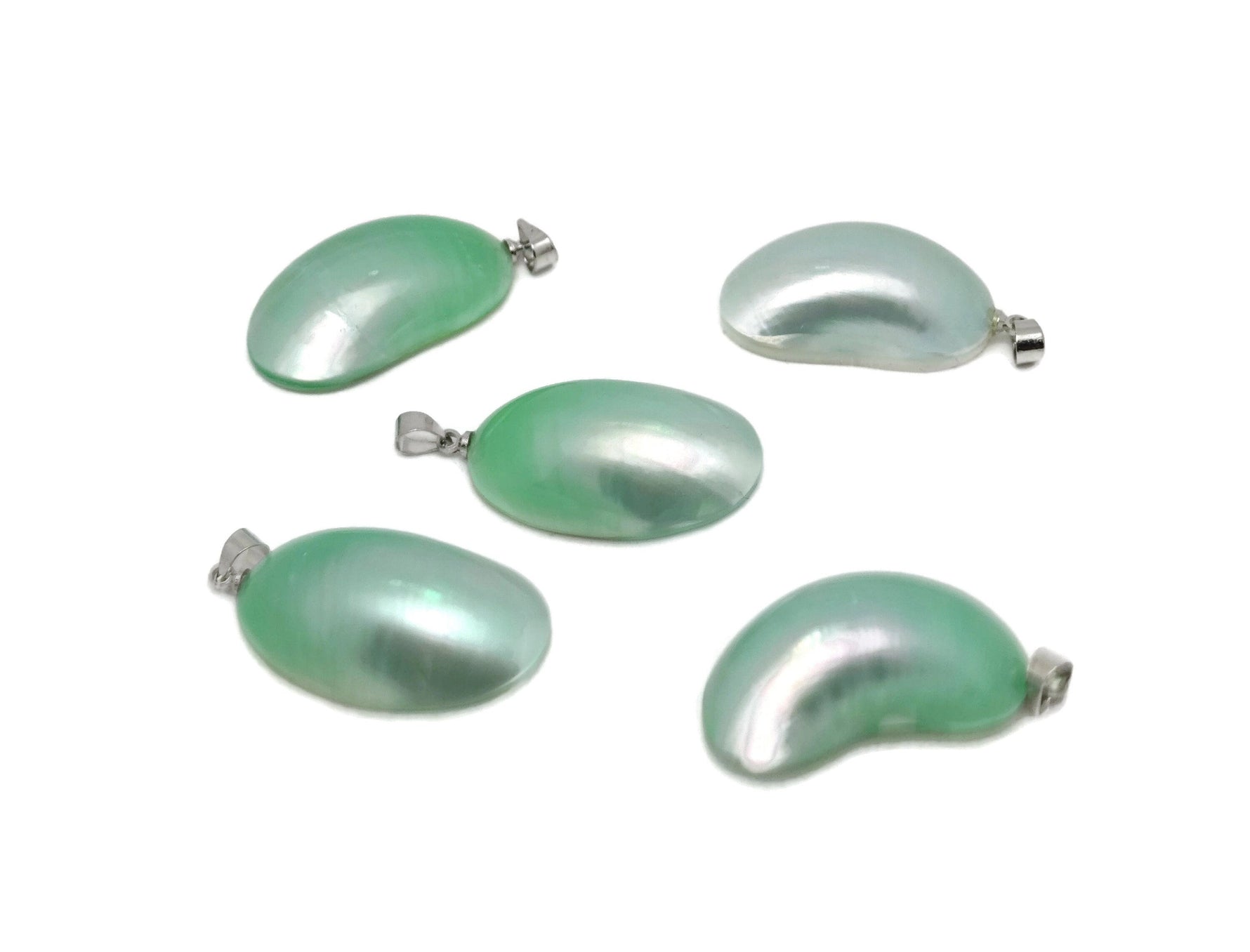 Green natural pearl pendant from GemstoneGO, showcasing a delicate jewelry-making crystal pendant on a white background.
