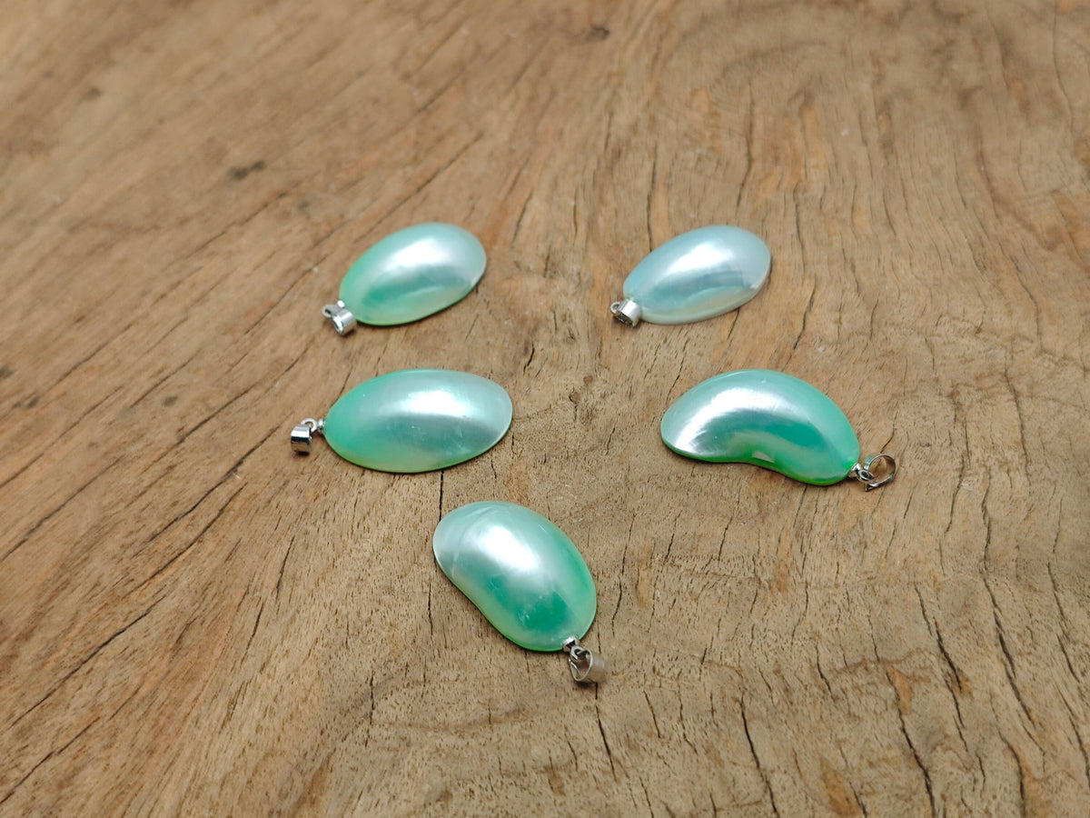 Green natural pearl pendant from GemstoneGO, showcasing a handcrafted jewelry piece with a smooth, lustrous pearl and crystal accents.