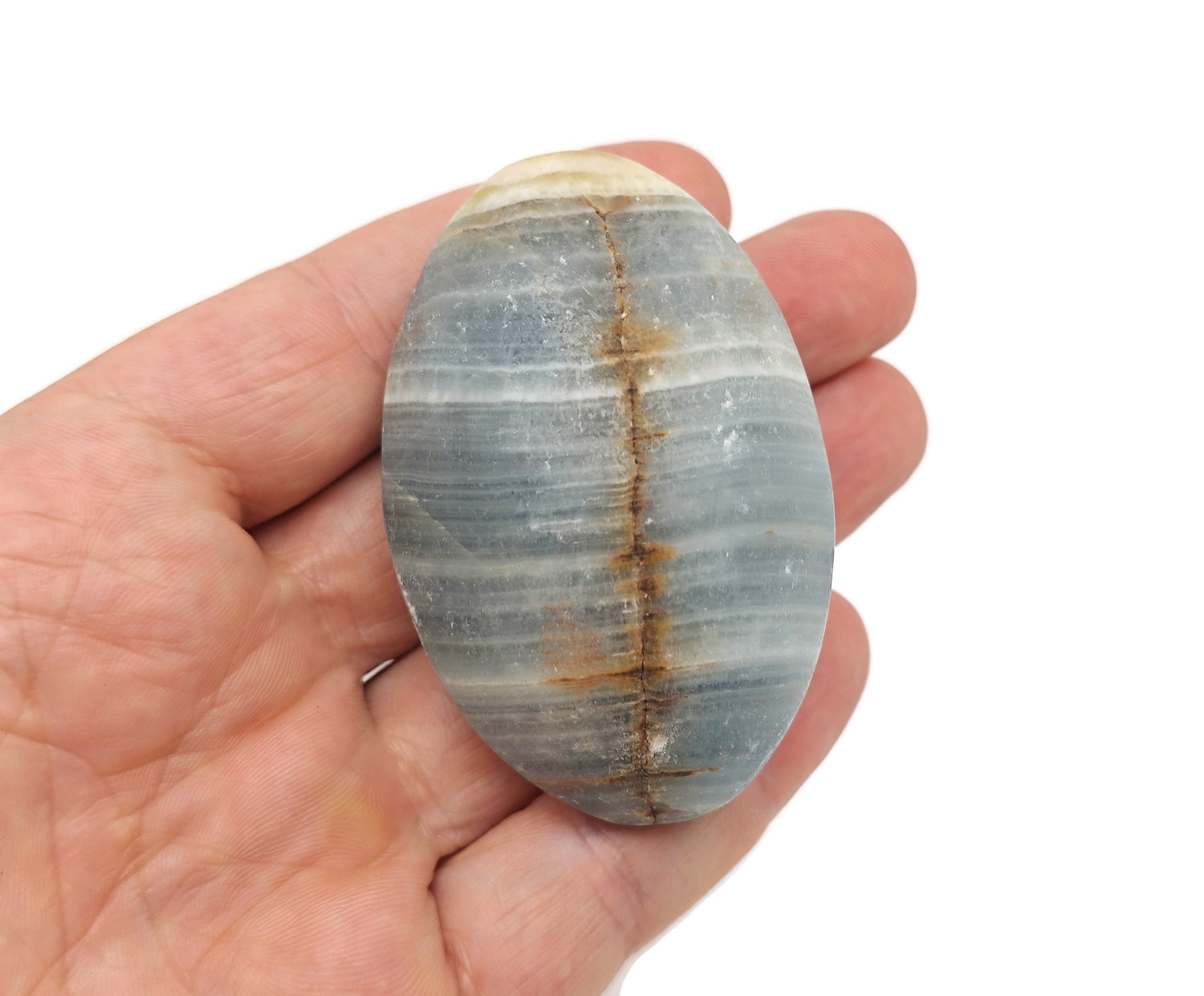 Blue onyx palm gemstone spa stone from GemstoneGO, smooth polished natural stone for relaxation and massage.