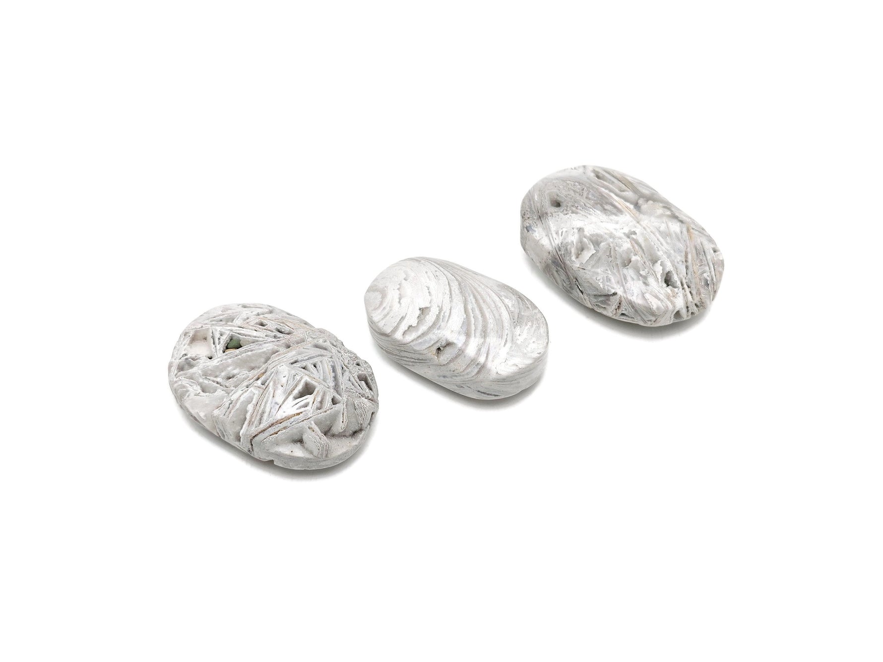 Mexican White Agate palm gemstone spa stone from GemstoneGO, showcasing smooth, polished white agate with natural banding patterns.