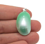 Green natural pearl pendant from GemstoneGO, showcasing a delicate jewelry-making crystal pendant with a smooth, polished surface.