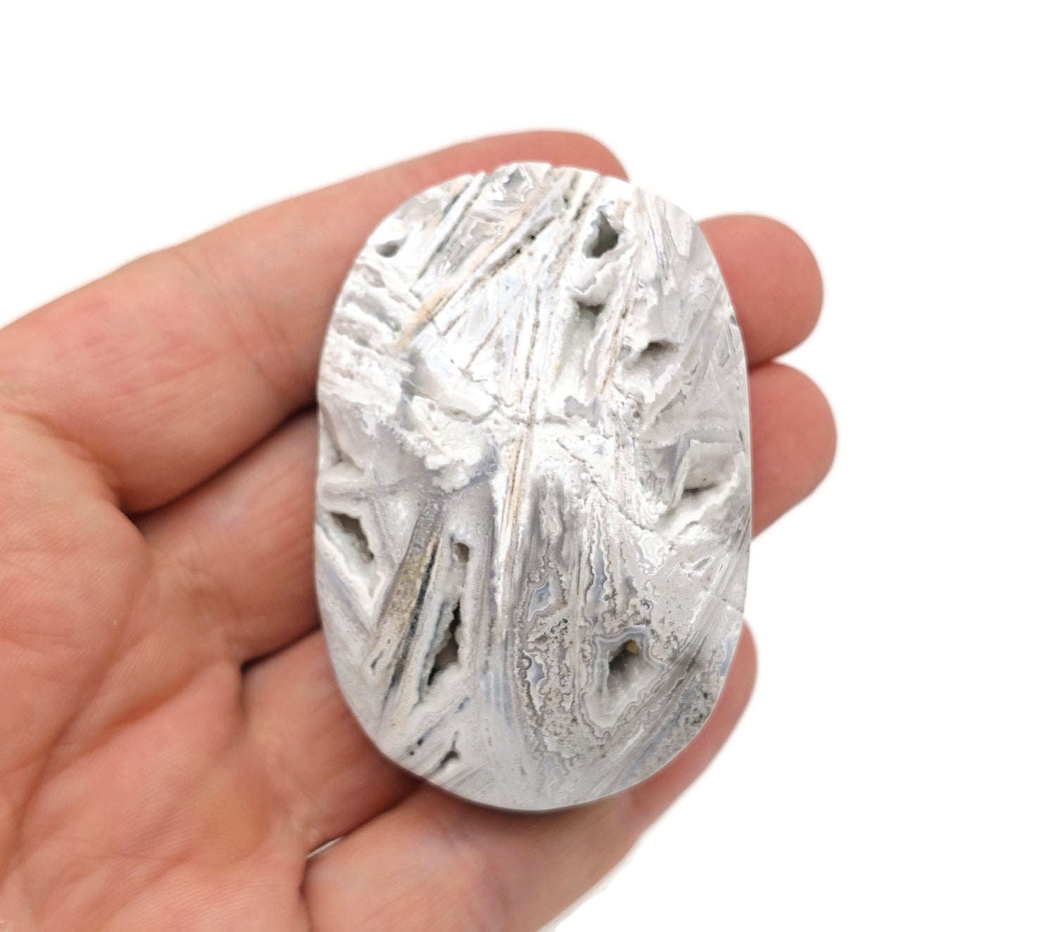 Mexican White Agate palm gemstone spa stone from GemstoneGO, smooth polished white agate with natural banding and rounded shape.