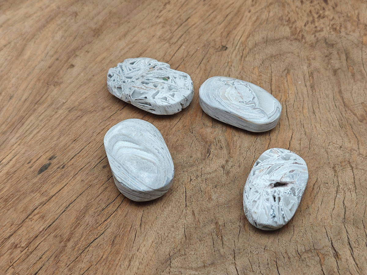 Mexican White Agate palm gemstone spa stone by GemstoneGO, smooth polished white agate with natural banding and rounded shape.