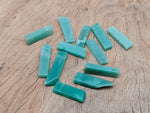 Aventurine drilled tumbled gemstone pendant from GemstoneGO showing a smooth green stone with drilled hole for jewelry.
