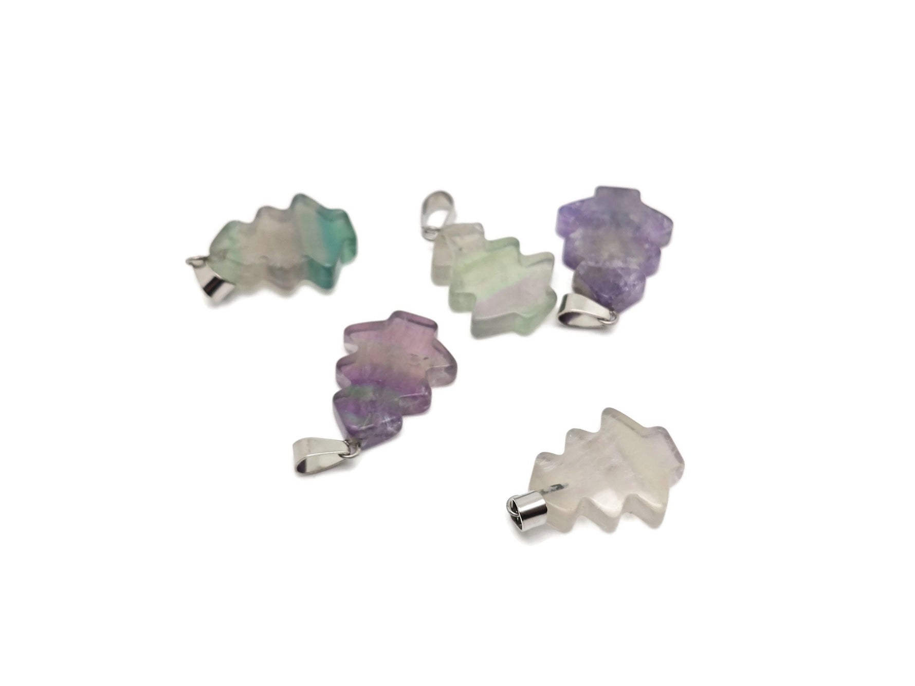 Mini fluorite pine tree gemstone pendant from GemstoneGO featuring vibrant green and purple crystals on a silver chain.