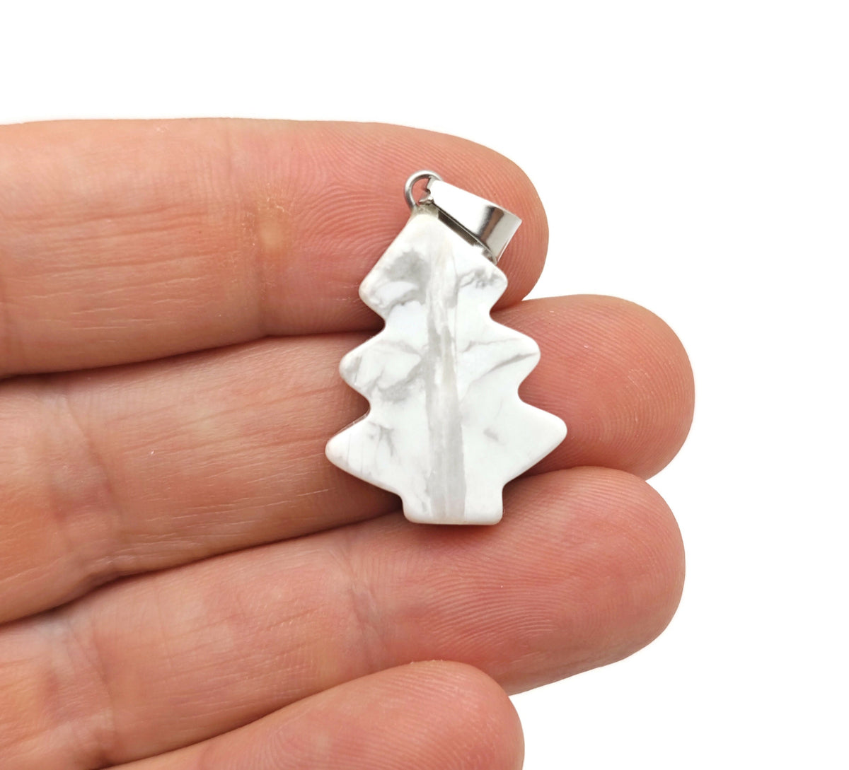 Mini Howlite pine tree gemstone pendant necklace by GemstoneGO, featuring a carved crystal pendant on a delicate chain.