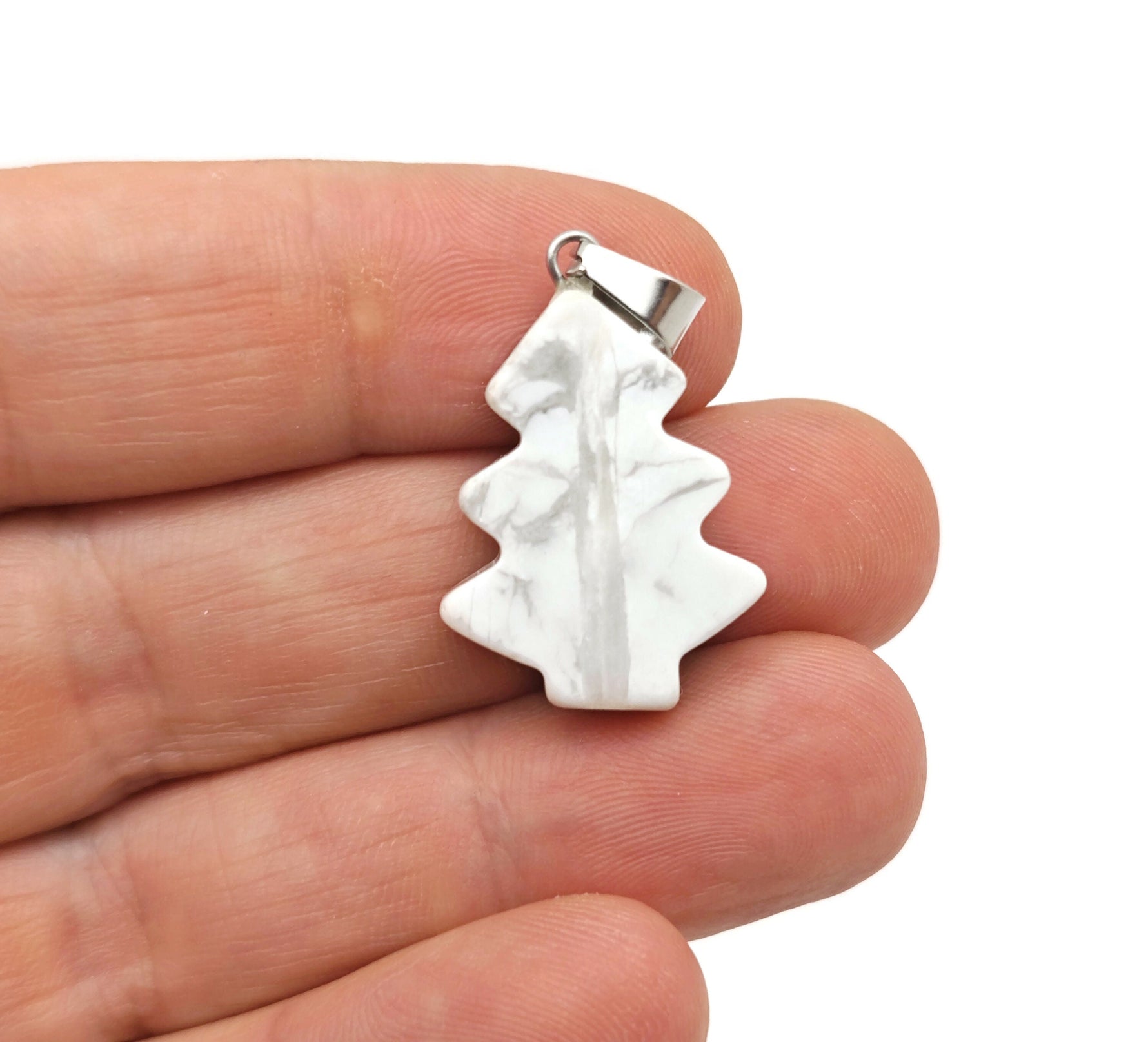 Mini Howlite pine tree gemstone pendant necklace by GemstoneGO, featuring a carved crystal pendant on a delicate chain.