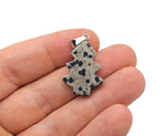 Dalmatian Jasper pine tree gemstone pendant from GemstoneGO featuring a mini crystal pendant with black and cream spotted pattern.