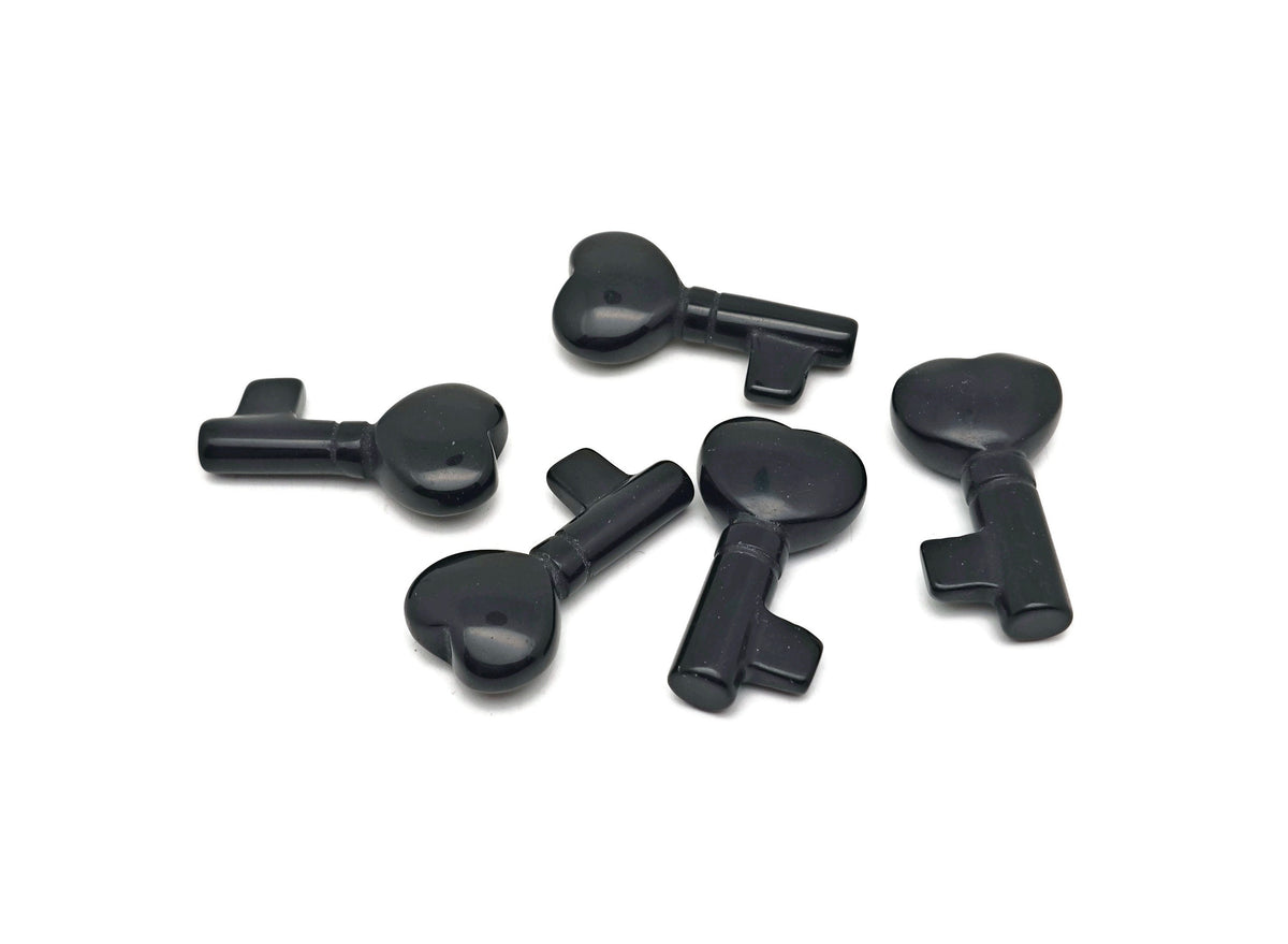 Obsidian key gemstone carving, 40mm, from GemstoneGO, featuring detailed craftsmanship and polished surface.