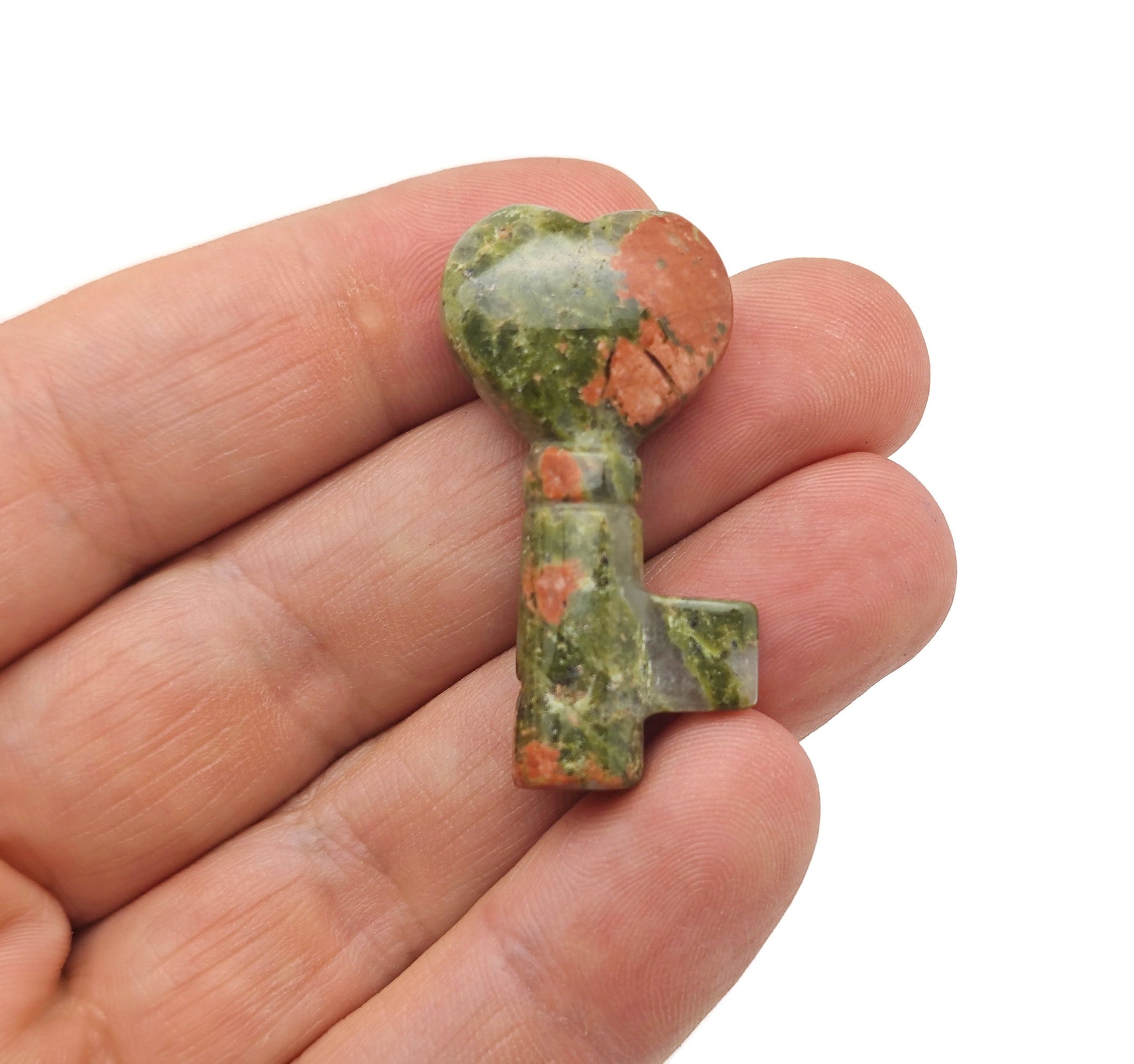 Unakite key gemstone carving, 40mm, from GemstoneGO, showing detailed carved key with natural pink and green hues.