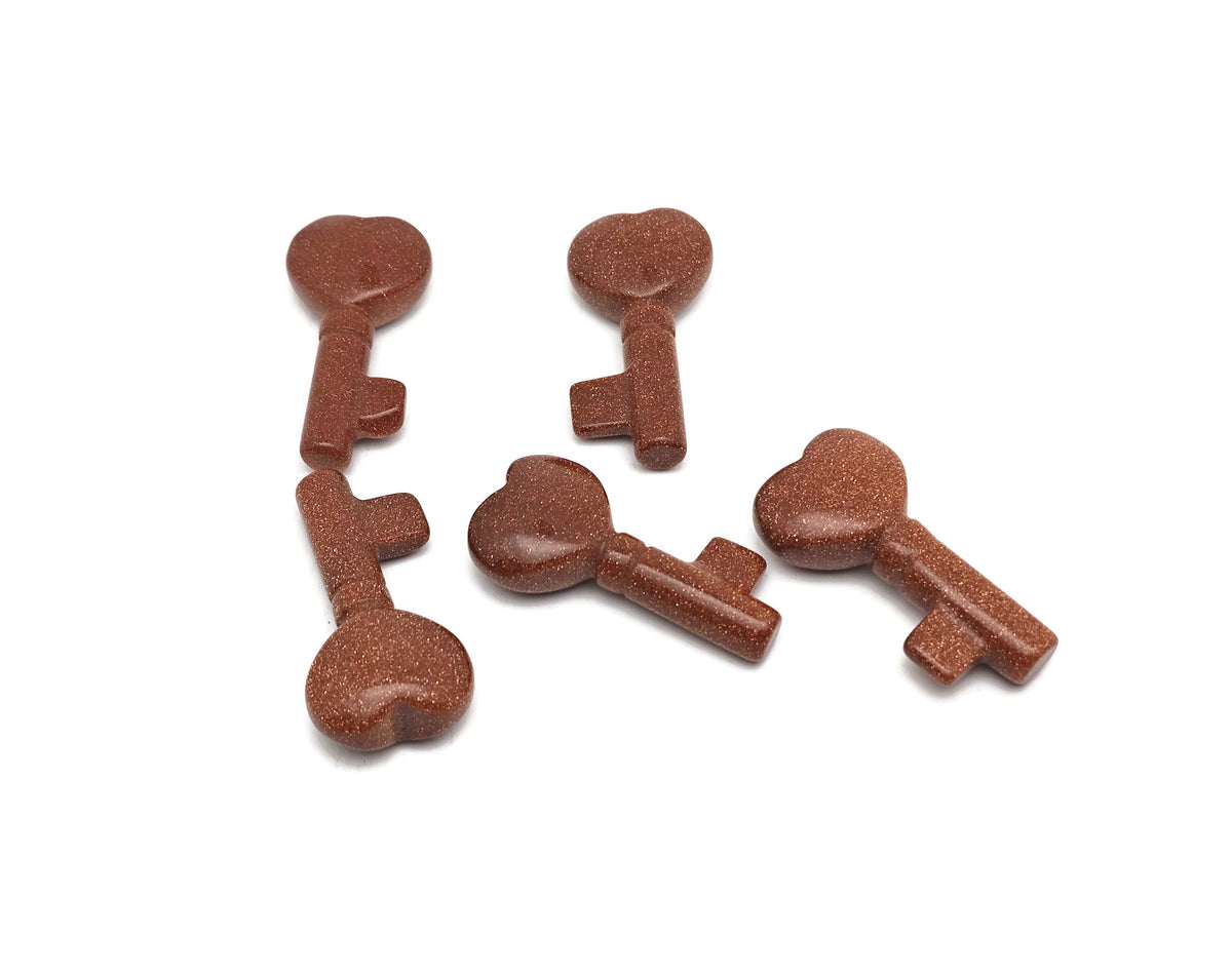 Goldstone key gemstone carving, 40mm, by GemstoneGO, featuring a detailed, polished goldstone sculpture with intricate craftsmanship.