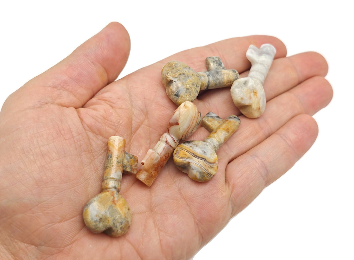 Crazy Lace Agate gemstone carving, 40mm key-shaped pendant from GemstoneGO, featuring intricate colorful lace patterns.