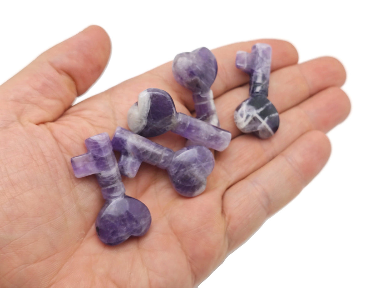 Amethyst gemstone key carving, 40mm, with intricate details and polished surface, from GemstoneGO.